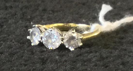 An 18ct gold and three stone diamond ring, size J.